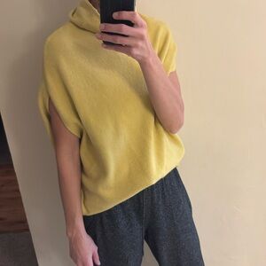 Sleeveless yellow sweater with turtleneck. Super soft and one size fits all